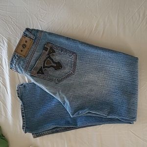 Distressed embellished buffalo jeans